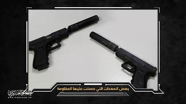 Pistols with silencers Hamas says were used by the Israel force