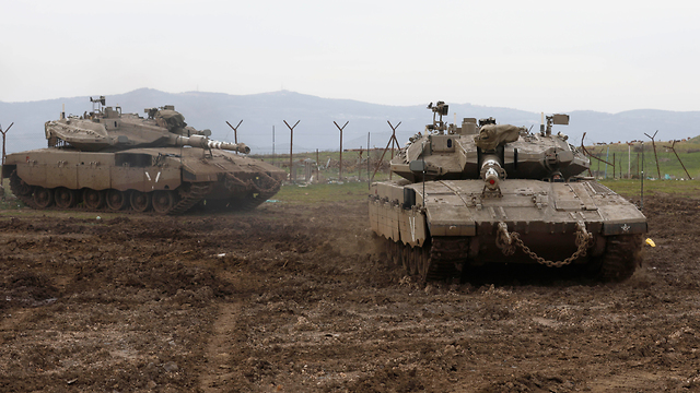 Израильские танки у границы с Сирией. Фото: AFP