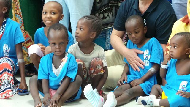 Tanzanian children receiving treatment by SACH professionals