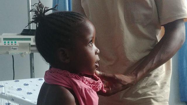 A Tanzanian child being treated by SACH professionals 