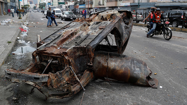 נזקי העימותים בוונצואלה (צילום: רויטרס)