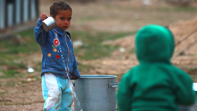 סוריה מחנה הפליטים אל חול 29 ילדים מתו (צילום: AFP)