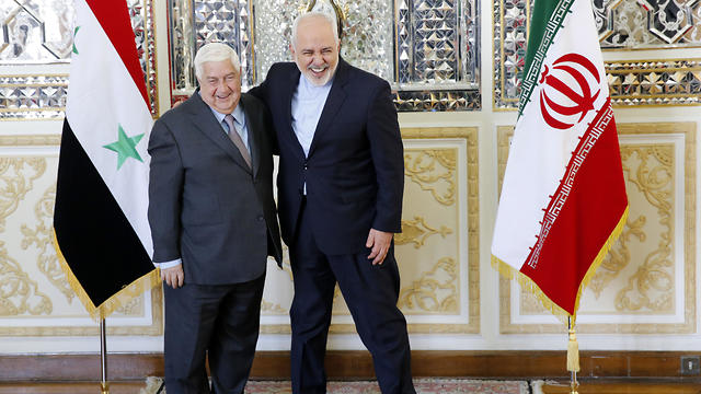 Iranian Foreign Minister Mohammad Javad Zarif (R) greets his Syrian counterpart Walid al-Moallem in Tehran, Iran, 05 February 2019. (Photo: EPA)