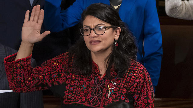 Rep. Rashida Tlaib wears a Palestinian thobe as she is takes her oath on the opening day of the 116th Congress