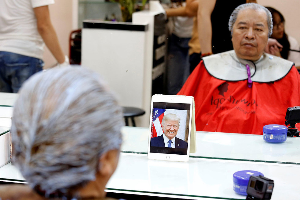 מספרה ב וייטנאם תספורת בחינם של דונלד טראמפ ו קים ג'ונג און (צילום: רויטרס)