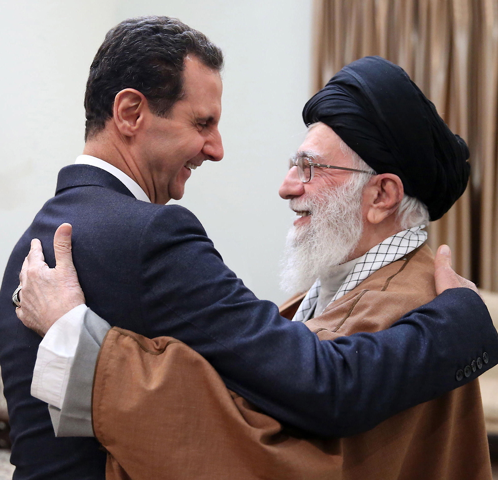מהניג העליון של איראן עלי חמינאי פגישה עם בשאר אסד  (צילום: EPA)