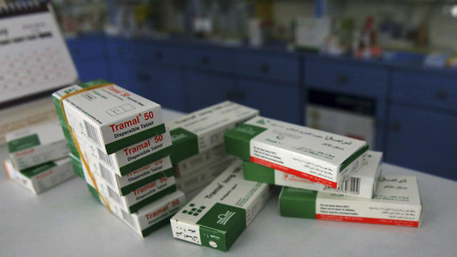 Tramal, an addictive pain killer, are stacked on the table of a pharmacy in Gaza City