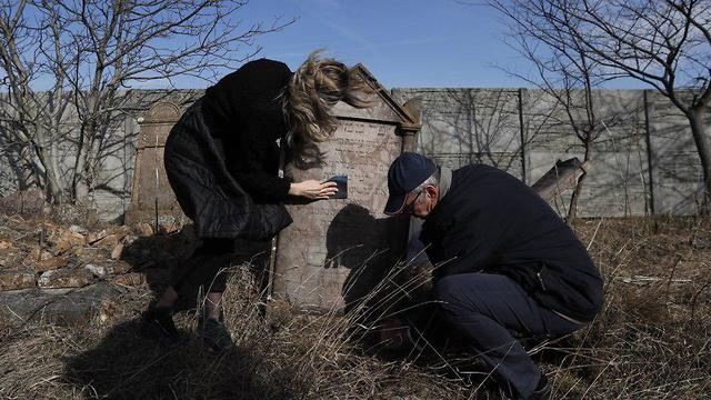 Preservation work at a Jewish cemetery in Slovakia (Photo: AP)