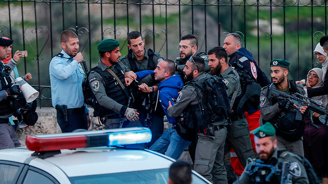 Muslim woirshippers and Border Police officers clash at the entrance to the Temple Mount 