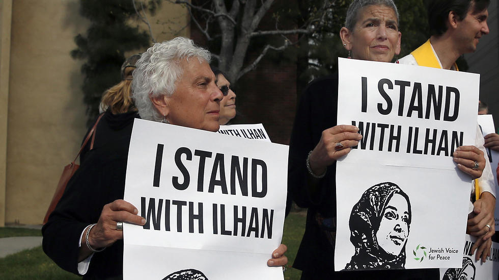 Protesters hold signs during a demonstration against Ilhan Omar, US Representative for Minnesota's 5th congressional district, in Woodland Hills, Los Angelesm California