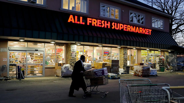 An Orthodox Jewish man walks through the parking lot of a supermarket in Spring Valley, NY (Photo: AP)