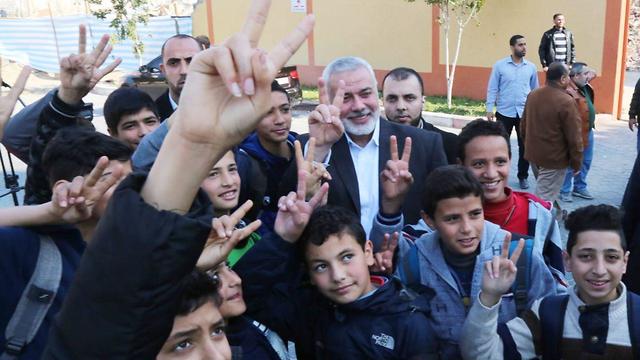 Haniyeh signals V sign with gaza children