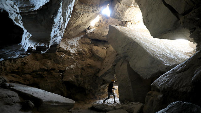 A member of the Hebrew University of Jerusalem Cave Research Center exits the Malham salt cave in Mount Sodom, March 27, 2019 