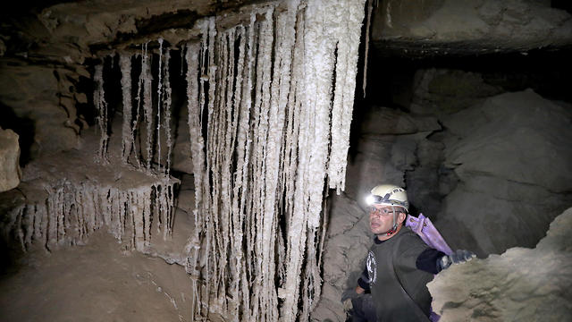 Yoav Negev, chairman of the Israel Cave Explorers Club, explores the Malham salt cave in Mount Sodom, March 27, 2019 