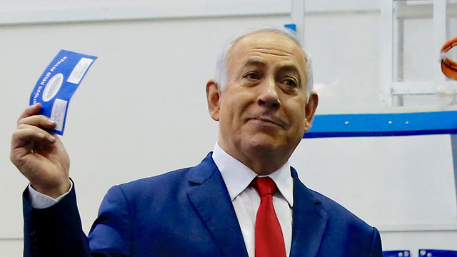 Netanyahu at the polls on Election Day (Photo: Reuters)