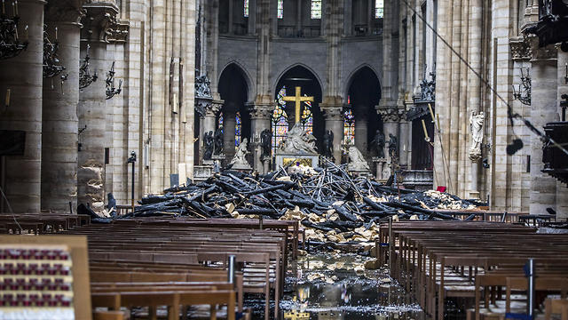 Debris are seen inside Notre Dame cathedral in Paris, Tuesday, April 16, 2019
