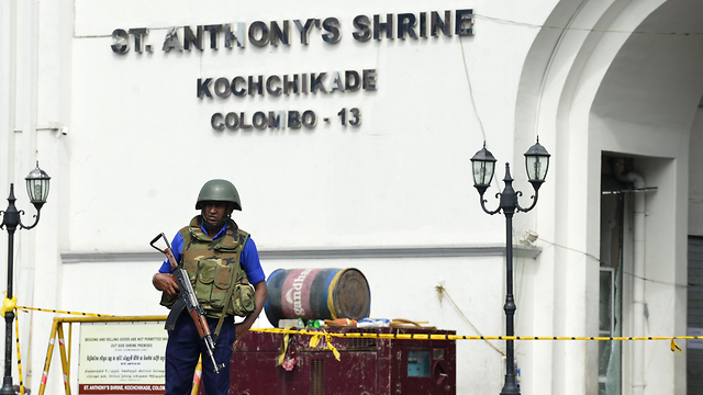 Police at the scene of one of the bombings (Photo: AFP)