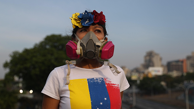 תומכים של חואן גוואידו (צילום: EPA)