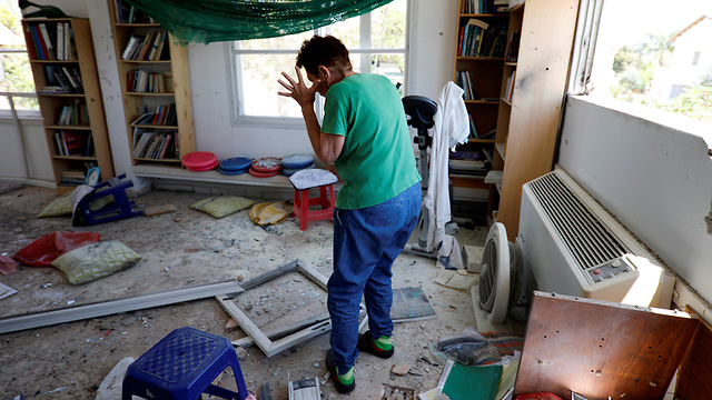 A home in a Gaza border community sustains a direct hit from a rocket  (Photo: Reuters)