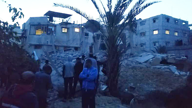 Palestinians inspect damage caused by IDF strikes in Gaza (Photo: IDF Spokesperson's Unit)