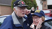 Doug Harvey, 95, and Holocaust survivor Sophie Tajch Klisman, 89, right, greet each other 