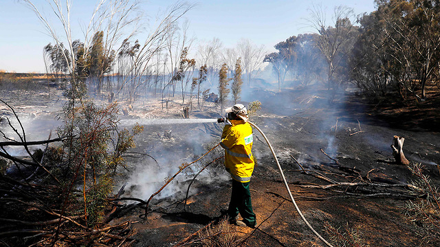 Firefighters put out a blaze in Kibbutz Nahal Oz in southern Israel  (Photo: AFP)