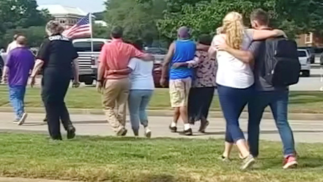 Evacuees walk away from a building in this still image taken from video following a shooting incident at the municipal center in Virginia Beach, Virginia, U.S. May 31, 2019.(Photo: Reuters)