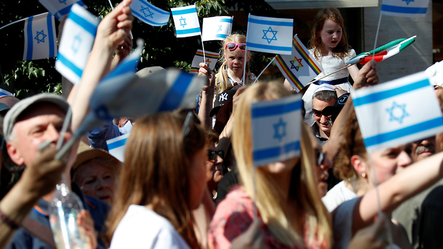 Supporters of Israel wave Israeli flags at a demonstration in Berlin on June 1, 2019 (Photo: Reuters)