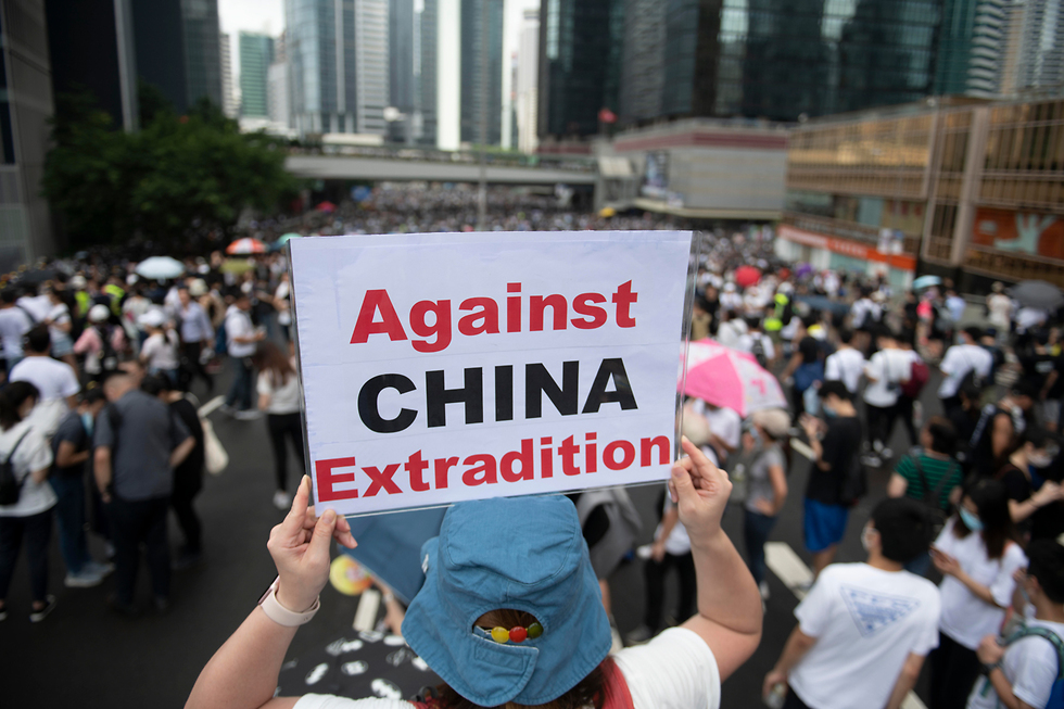 הפגנות הפגנה מחאה הונג קונג נגד חוק ההסגרה הסגרה ל סין (צילום: EPA)