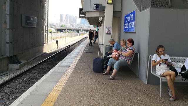 Passengers waiting for trains at a Tel Aviv station on Thursday 
