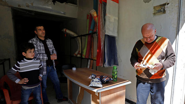 Merchants at Aleppo market (Photo: Reuters)