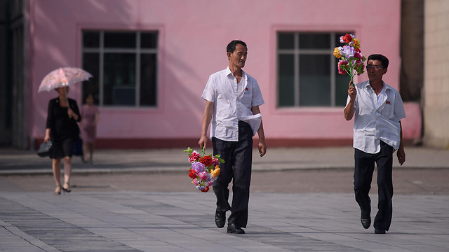 ביקור נשיא סין ב צפון קוריאה פיונגיאנג (צילום: AFP)
