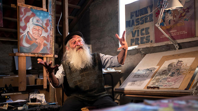Michael Netzer gestures as he speaks from his attic studio at his home on the settlement of Ofra on May 28, 2019