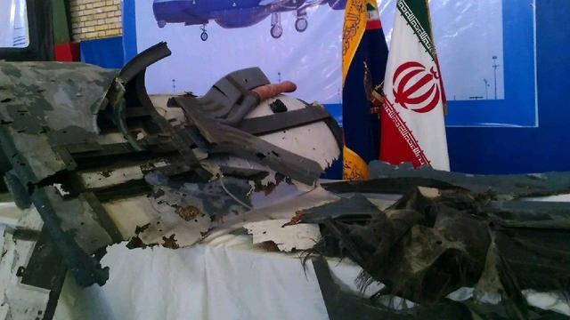 Iran displays fragments of the U.S. spy drone it claims was shot down in its airspace last month