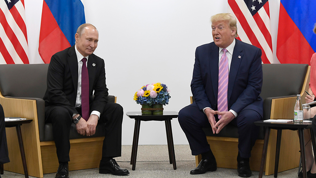 Vladimir Putin and Donald Trump at the G20 in Japan earlier this year (Photo: AP)