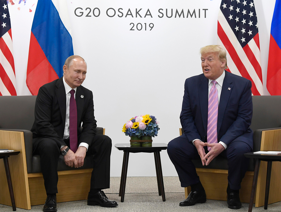 Путин и Трамп на встрече в Осаке. Фото: AP (צילום: AP)