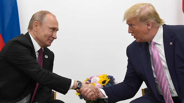 Vladimir Putin and Donald Trump at the G20 earlier this year (Photo: AP)