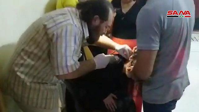 טיפול בפצועים מהתקיפה בדמשק ובחומס ()