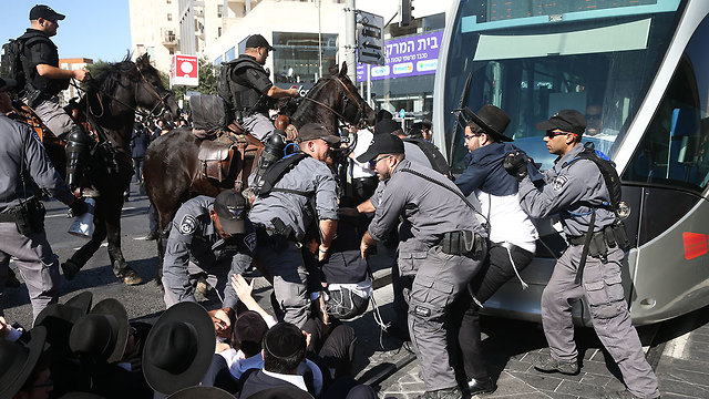 Ultra-Orthodox men clash with police in Jerusalem during a protest against the Haredi draft (Photo: Ohad Zwigenberg)