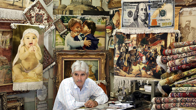 Iranian murchant in his shop (Photo: AP) (Photo: AP)