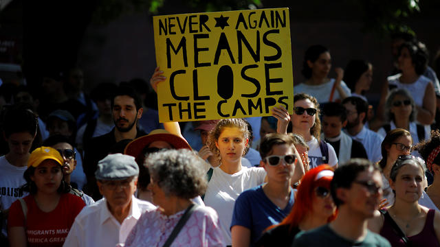 Demonstrators take part in the Never Again Para Nadir protest, led by Jewish groups, against ICE Detention camps in Boston, July 2, 2019.