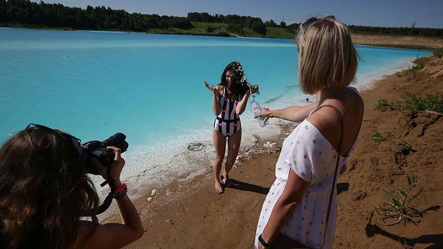 Instagram models flock to the toxic lake (Photo: AFP)