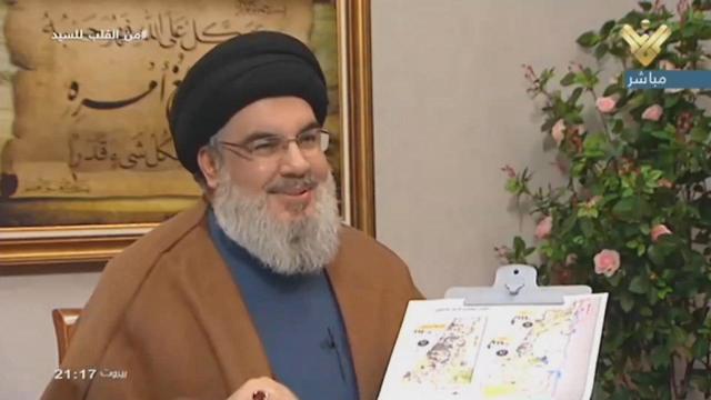  Nasrallah during Al-Manar interview holding map of Israel