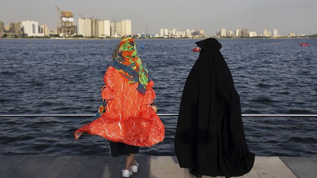Women spend an afternoon around the Persian Gulf Martyrs' Lake in Tehran