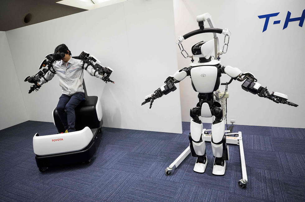 רובוט שיוצר במיוחד כדי לסייע באולימפיאדת טוקיו (צילום: AFP)