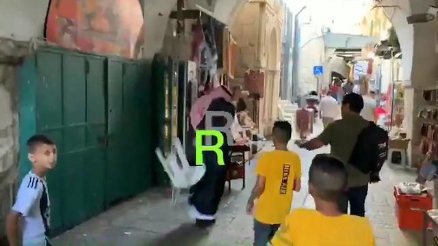 Chairs are thrown at Mohammed Saud in the Old City of Jerusalem
