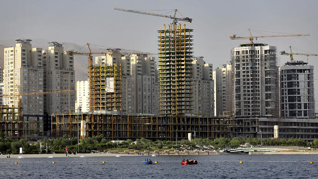 esidential towers in District 22, comprising apartment high-rises and shopping malls around an artificial lake, under construction on the northwestern edge of Tehran, July 6, 2019 