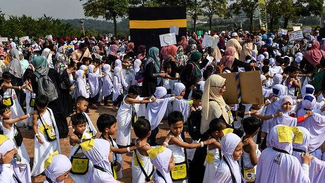 טקס חאג' אלטרנטיבי בבירת מלזיה קואלה לומפור (צילום: AFP)