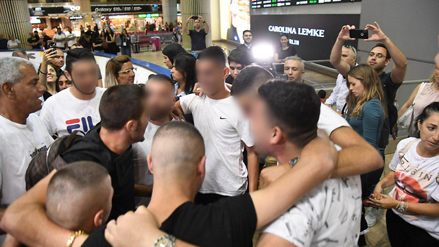 Celebrations as the teens falsely accused of rape return to Israel (Photo: Yair Sagi)