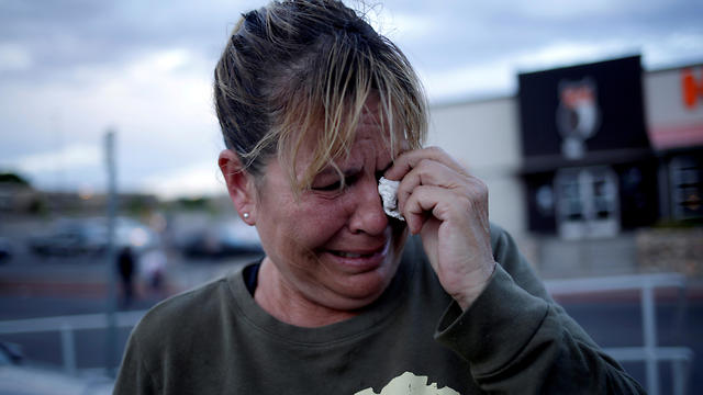 An El Paso resident weeps after the mass shooting in the city (Photo: Reuters)